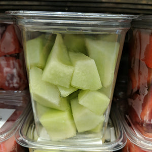 Fresh cut fruit in plastic take away containers a a Whole Foods in